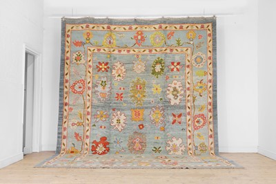 Lot 240 - A large Oushak wool carpet