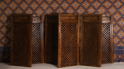 Lot 709 - A series of six Chinese hardwood screen panels