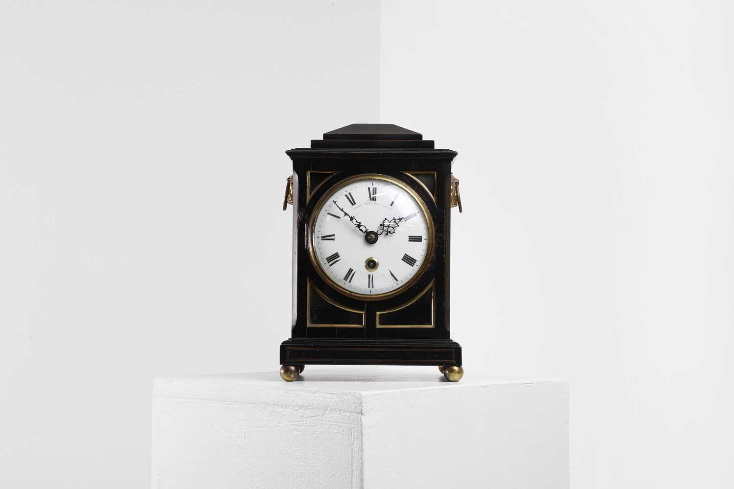 Lot 431 - A George III ebonised table timepiece