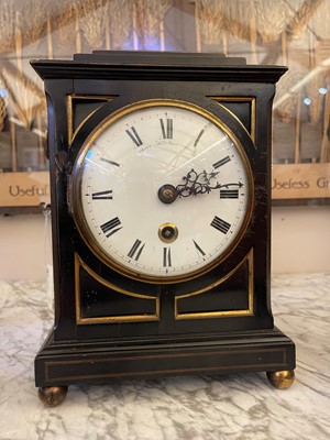 Lot 431 - A George III ebonised table timepiece