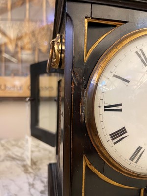 Lot 431 - A George III ebonised table timepiece