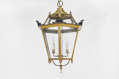Lot 80 - A large brass hanging porch lantern by Charles Edwards
