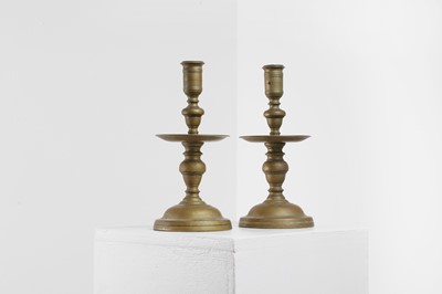 Lot 399 - A pair of Heemskerk-type brass candlesticks
