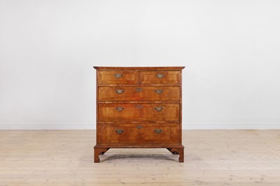 Lot 232 - A walnut and feather-banded chest of drawers