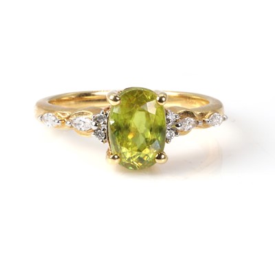 Lot 183 - An 18ct gold sphene and diamond ring