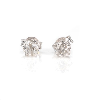 Lot 105 - A pair of white gold diamond stud earrings