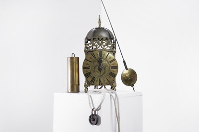 Lot 318 - A brass single-handed lantern clock