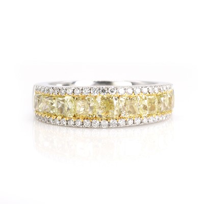 Lot 198 - An 18ct white gold diamond and fancy coloured diamond ring