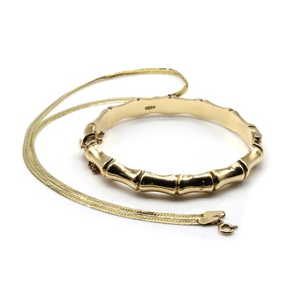 Lot 248 - A 9ct gold bangle and a 9ct gold chain