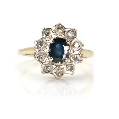 Lot 166 - An 18ct gold sapphire and diamond cluster ring