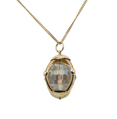 Lot 377 - A 9ct gold chain suspending a paste orb pendant