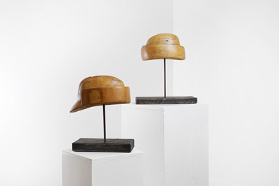 Lot 696 - Two fruitwood hat moulds