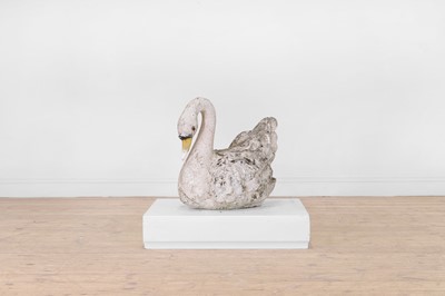 Lot 684 - A painted composition stone swan