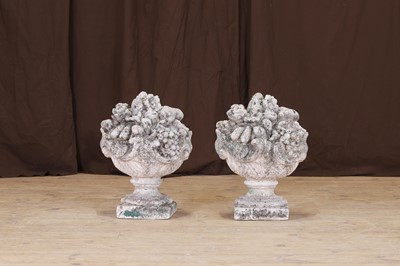 Lot 704 - A pair of composition stone gatepost finials
