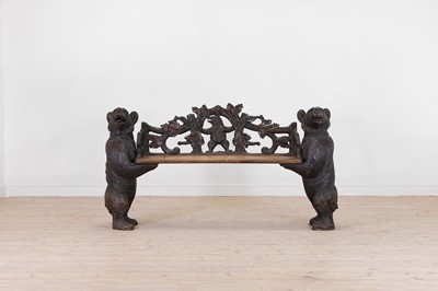 Lot 587 - A Black Forest carved wooden bench