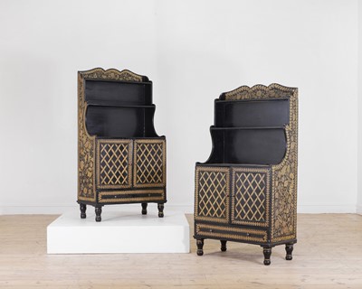 Lot 195 - A pair of Regency black lacquer and penwork waterfall bookcases