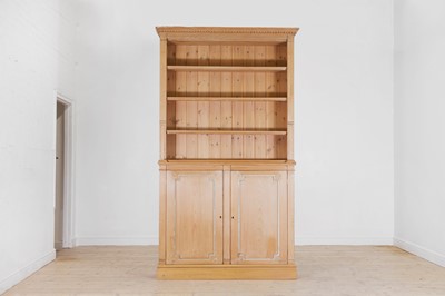 Lot 30 - A George III-style stripped pine bookcase