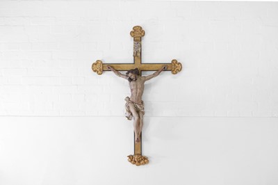 Lot 252 - A carved, painted and giltwood crucifix