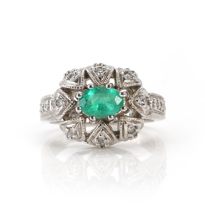 Lot 95 - A 14ct white gold emerald and diamond ring