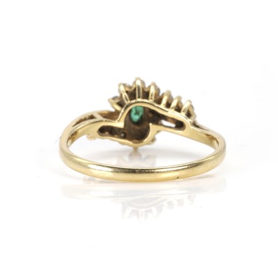 Lot 90 - An 18ct gold emerald and diamond cluster ring