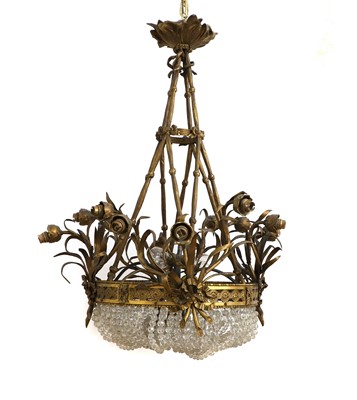 Lot 564 - A gilt bronze and cut glass twelve light basket chandelier