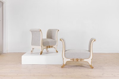 Lot 458 - A pair of painted and parcel-gilt window seats