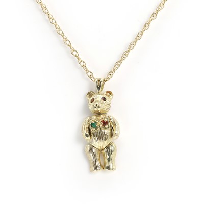 Lot 126 - A 9ct gold articulated bear pendant