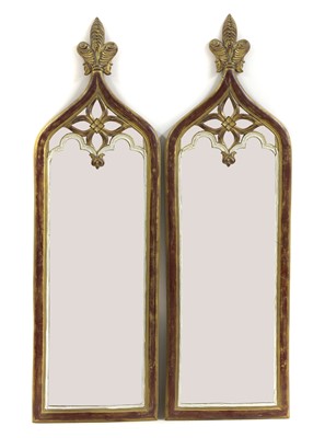 Lot 625 - A pair of ecclesiastical design pier mirrors