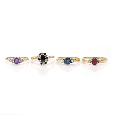 Lot 257 - A group of four coloured gemstone and diamond rings