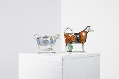 Lot 457 - Two pottery cow creamers