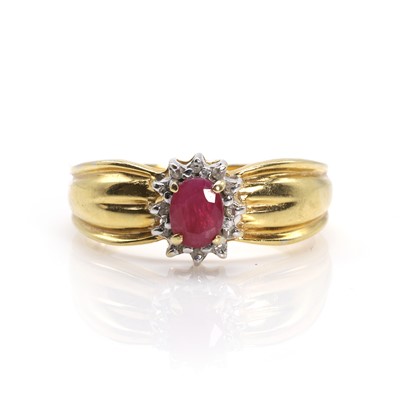 Lot 80 - An 18ct gold ruby and diamond cluster ring