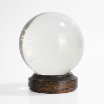 Lot 29 - A 'glass' crystal ball on a period wood stand