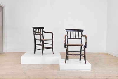 Lot 10 - A pair of Victorian ebonised beech elbow chairs