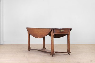 Lot 75 - A provincial oak drop-leaf dining table