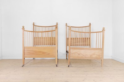 Lot 102 - A pair of George III-style birch single beds