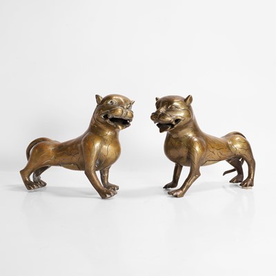 Lot 407 - A pair of Indian brass models of lions