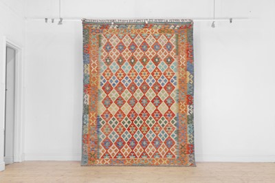 Lot 614 - A kilim flat-weave wool rug