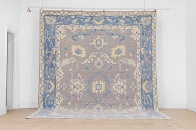 Lot 499 - An Oushak wool carpet