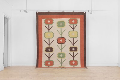Lot 310 - A Colefax and Fowler-inspired flat-weave wool rug