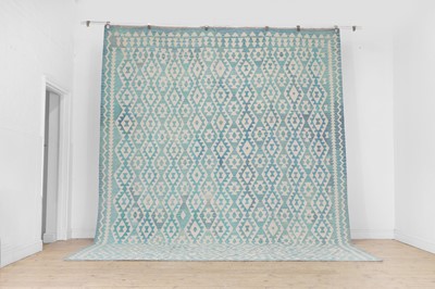 Lot 444 - A kilim flat-weave wool carpet