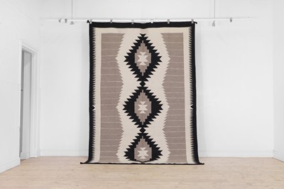 Lot 325 - A Navajo-inspired kilim flat-weave wool rug