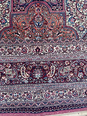 Lot 513 - A Persian Mashad Amoghli wool carpet