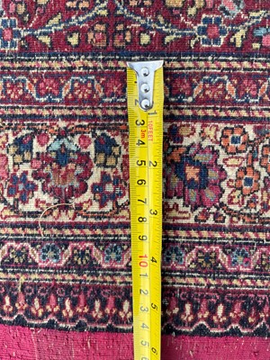 Lot 513 - A Persian Mashad Amoghli wool carpet