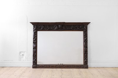 Lot 491 - A carved oak overmantel mirror