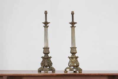 Lot 670 - A pair of Regency-style bronze table lamps