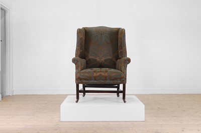 Lot 180 - A George III mahogany wing armchair