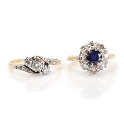Lot 271 - A three stone diamond ring and a sapphire and diamond ring