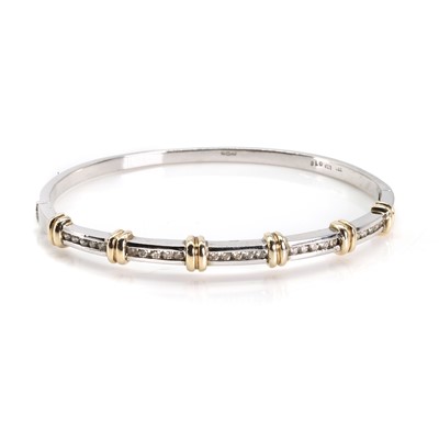 Lot 113 - A 9ct two colour gold diamond hinged bangle