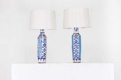 Lot 314 - A pair of Persian Qajar-style glazed pottery table lamps