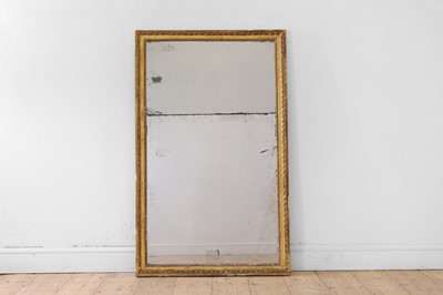 Lot 4 - A Louis XVI carved giltwood pier mirror